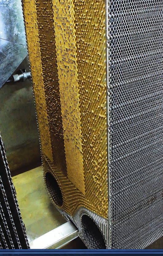 Heat exchanger plate pack fouled with mineral scale